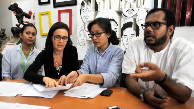 Haris Azhar (right) with colleagues from the Commission for the Disappeared and Victims of Violence (Kontras) and Brazilian woman Angelita Muxfeldt plead for the life of Angelita's cousin Rodrigo Gularte in Jakarta, February 2015. Gularte was executed alongside Andrew Chan and Myuran Sukumaran in April last year. 