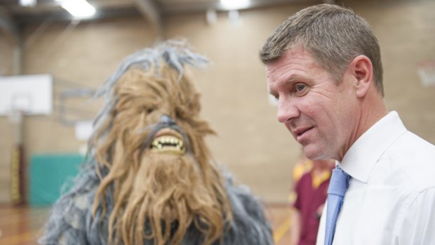Mike Baird with a yowie mascot at the Queanbeyan basketball centre.