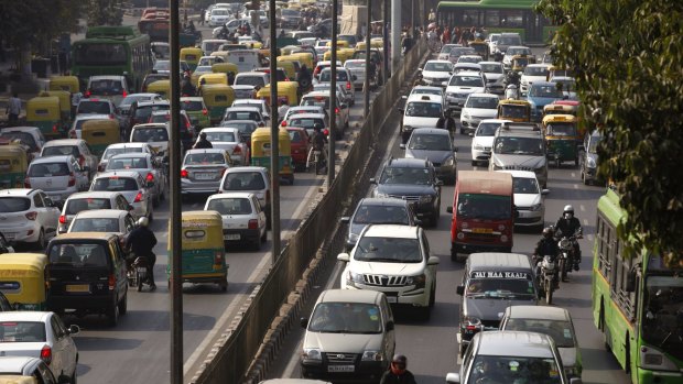 Cars and buses clog a road in New Delhi on Wednesday. 