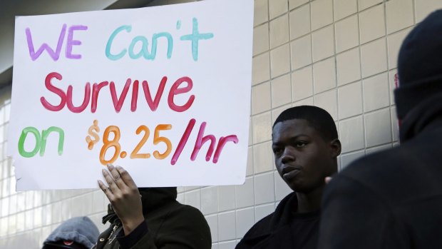 Protesters demonstrate outside a McDonald's restaurant in Oakland, California, at the start of the minimum wage campaign in 2013.