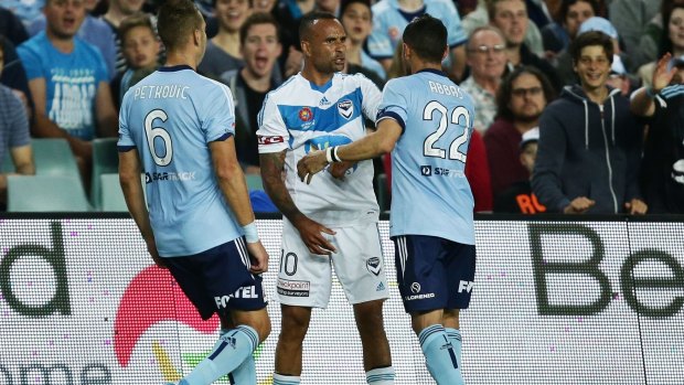 Eventful night: Archie Thompson and Ali Abbas exchange words during the match.