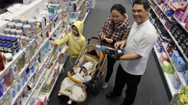 Pharmacist Ben Jackson with Cherry Yang and children Adam, 4, and Sophia, 6 months. 