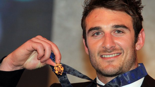 Jobe Watson with the 2012 Brownlow which he had to hand back.