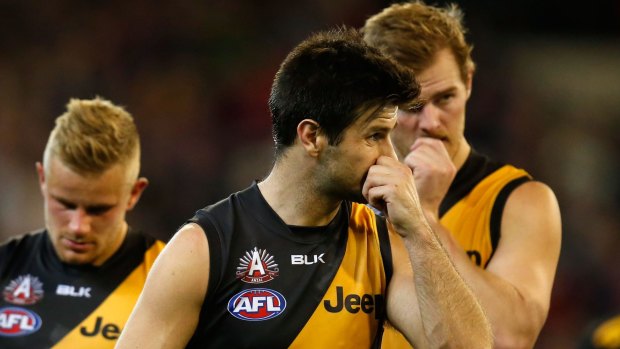 On the nose: Trent Cotchin leads the Tigers off the MCG after the loss to Melbourne.