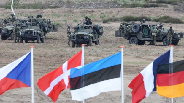 Soldiers take positions with their army vehicles during the NATO Noble Jump exercise on a training range near Swietoszow Zagan, Poland, in 2015. Poland said on Wednesday it welcomes a US plan to quadruple military spending in Europe.