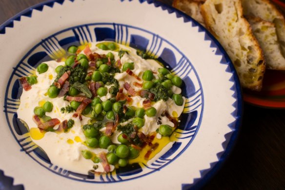 Stracciatella with peas, pancetta, salmoriglio and pangrattato with focaccia. 