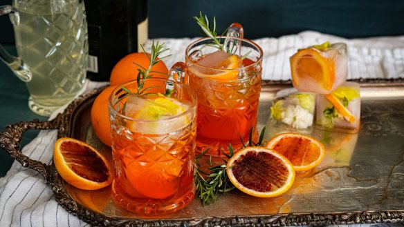 Aperol spritzes with optional fruit-filled ice cubes. 