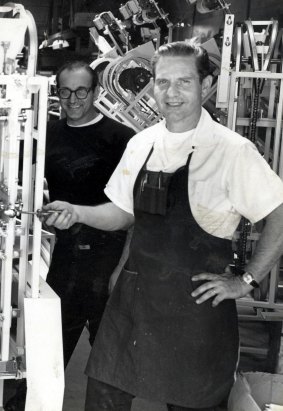 Daniel Thompson with his machine capable of making some 4800 bagels per hour, at his shop in Los Angeles in 1968.