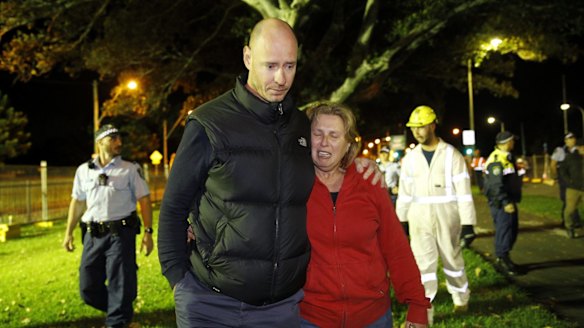 Greg Vankuyk and Sharon Bowen leave the enclosure after protesting
against the destruction of more Moreton Bay Fig trees on Anzac Parade.