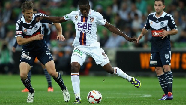 New start: Ndumba Makeche in action for Perth Glory against Melbourne Victory in 2013.