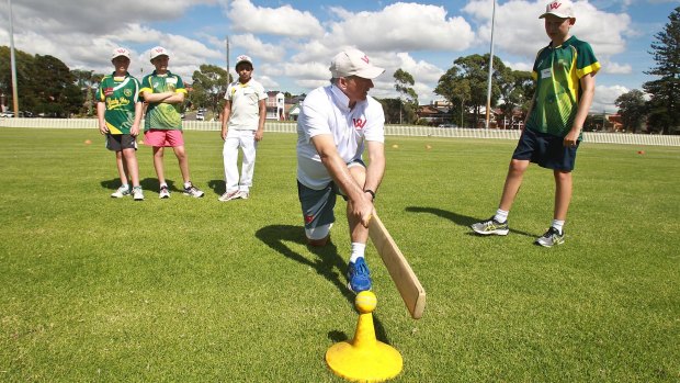 SYDNEY, AUSTRALIA - JANUARY 18:  Australian cricket legend Steve Waugh coaches kids during one of his clinics at Snape Park, Maroubra during the school holidays.Showing them a Reverse Sweep on January 18, 2016 in Sydney, Australia.  (Photo by Ben Rushton/Fairfax Media)