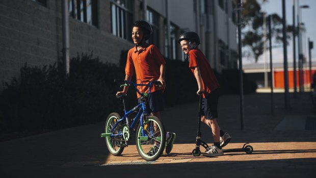 Amaroo primary year 4 students Parris Bangweni and Zayne Tennent at the school for an announcement of funding to expand active travel options for ACT students. 