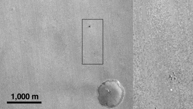 A spot, indicated by a rectangular box, that is likely the impact of the European Space Agency's Schiaparelli test lander on Mars.
