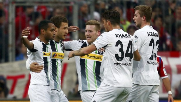 Borussia Moenchengladbach's Raffael (left) celebrates his goal with teammates.