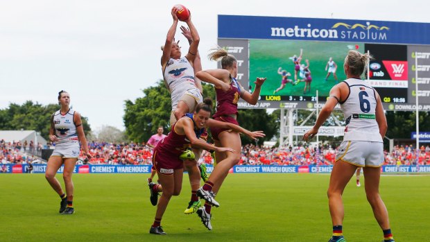 Erin Phillips taking a mark in the grand final. The summer playing conditions for the AFLW put a premium on speed and athleticism. 