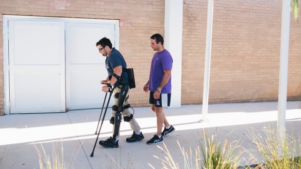 Paul Jenkins spent months learning to walk with bionic legs with exercise physiologist Jim Barrett.