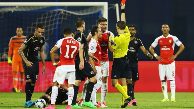 Arsenal's Olivier Giroud is shown the red card.