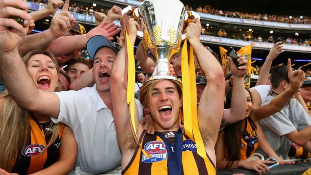 Ryan Schoenmakers celebrates with the premiership cup.