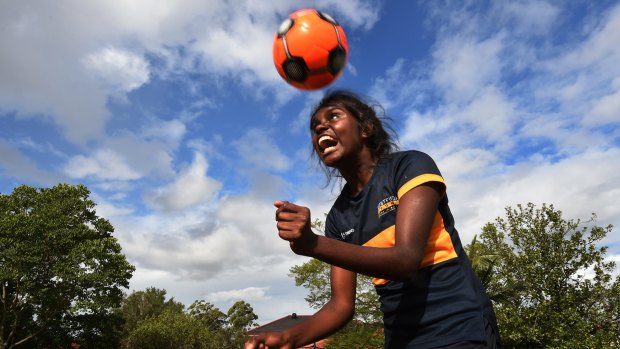 Shadeene Evans, 14, from Borroloola in the Northern Territory, runs through some football drills at Westfield Sport High School.