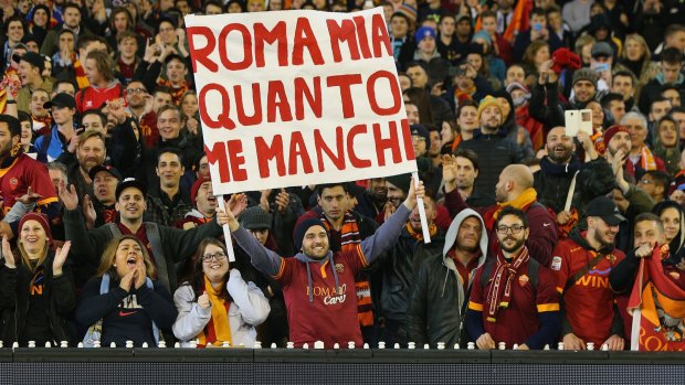 Roma fans show their support, with a banner that reads: 'Oh Rome of mine, I miss you so'.