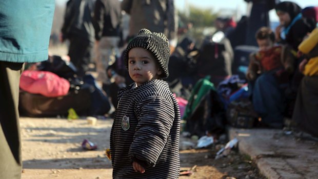 A young Syrian child evacuated from Aleppo arrives at a refugee camp in Rashidin, near Idlib, Syria.