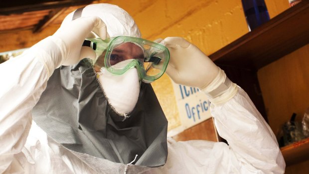 Health authorities prepared for Ebola outbreak: A doctor wears protective gear at ELWA hospital in Monrovia.