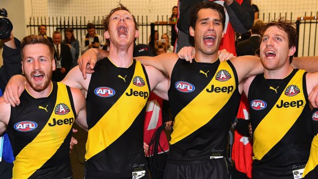 Jack Riewoldt (second from left) and fellow Richmond leader Alex Rance (third from left) celebrate the Tigers' win over  Melbourne. 