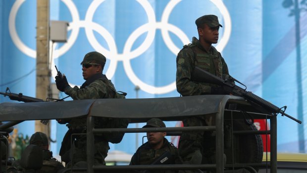 Under scrutiny: Brazilian soldiers keep watch in front of the beach volleyball venue.