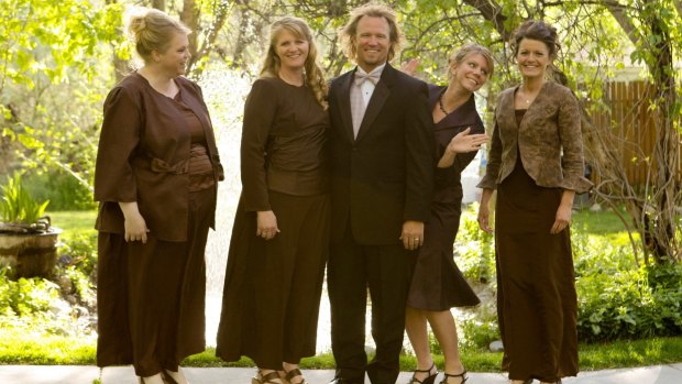 Kody Brown, centre, poses with his wives, from left, Janelle, Christine, Meri, and Robyn in a promotional photo for TLC's reality TV show, Sister Wives. 