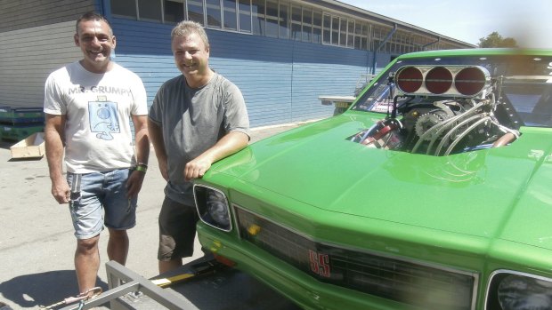 The morning after: Andy Lopez, Summernats co-owner, left, says good bye to Canberra's Brad Sullivan who brought his supercharged outlaw LX Torana SS to the event for the first time. 