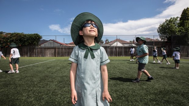 Bright future: Our Lady of Fatima year 2 student Glorianna Yudhistira, 7, wears the school's uniform sunglasses.