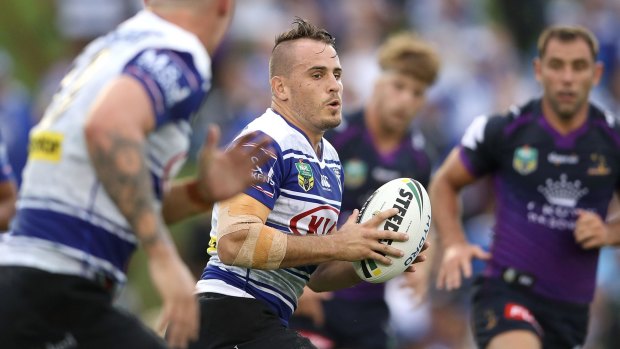 Running man: Josh Reynolds takes on the Storm defence on Friday night.