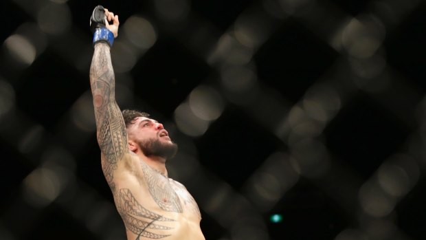 Rising star: Tyson Pedro celebrates his win in Melbourne at UFC Fight Night.