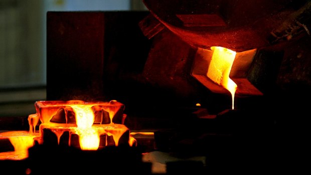 Mixed gold and silver are poured into ingot moulds at the furnace facility of Akara Mining's Chatree gold mine near Phichit village, 280-kilometres north of Bangkok.