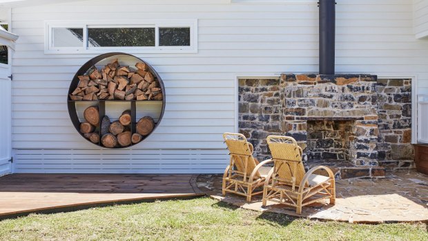 The outdoor fireplace is worth lighting even on balmy days.
