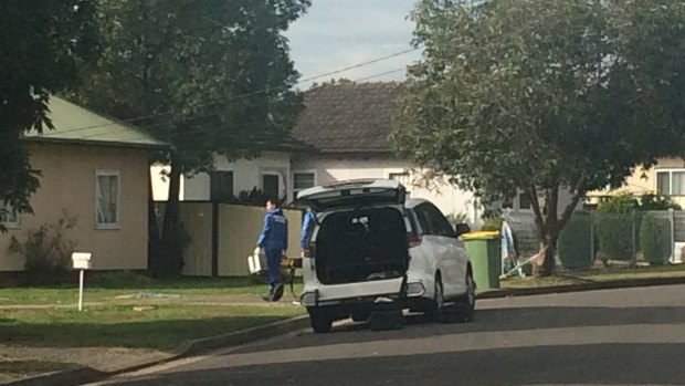 Forensic officers enter the Belmore Street house where body of Mahmoud Hrouk, 16, was discovered on Sunday, May 16.