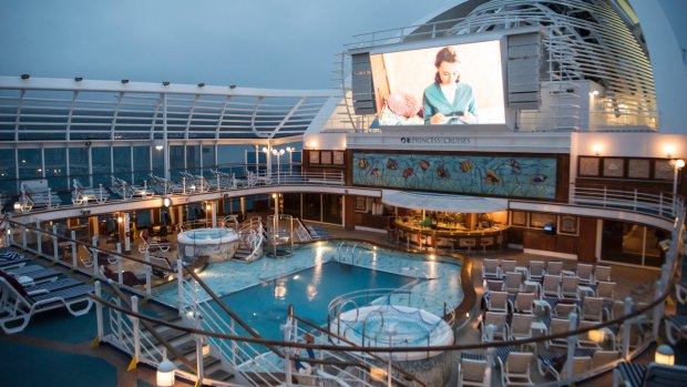 Catch a movie on the deck of the Emerald Princess.