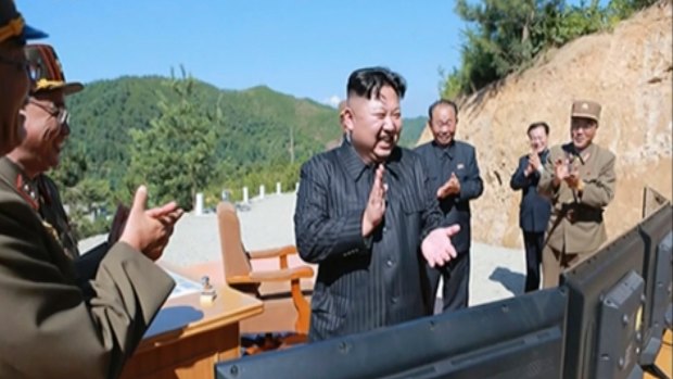 North Korea leader Kim Jung-un, centre, applauding after the launch of a Hwasong-14 intercontinental ballistic missile (ICBM) last month.