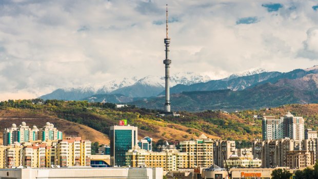 Modern architecture contrasts with older bulidings in in the historic centre of Almaty.