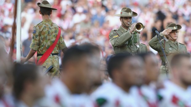 Respect: The Last Post is played during pre-game Anzac Day commemorations in 2016.