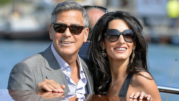 Some argue that George Clooney, with wife Amal, improves with age because he looks more interesting.