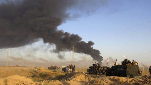 Smoke rises from Islamic State group positions after an air strike by US-led coalition warplanes in Fallujah last week. 