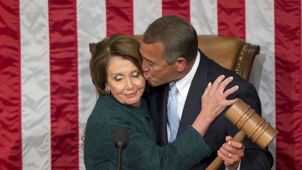 US House Speaker John Boehner  kisses House Minority Leader Nancy Pelosi as Republicans take control of Congress. 