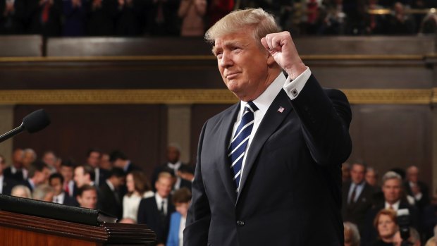 President Donald Trump gestures as he arrives on Capitol Hill on Tuesday.