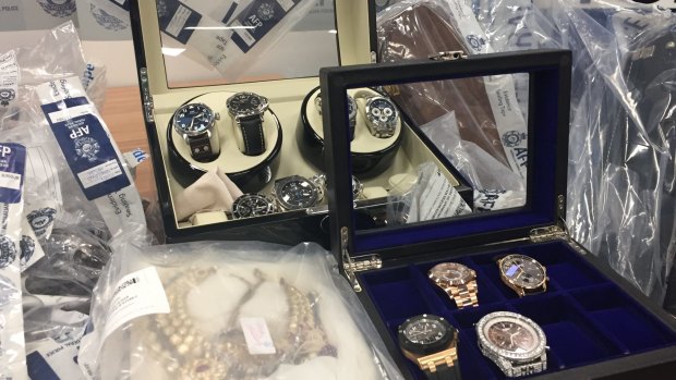 Police have seized hundreds of items, including $500,000 in watches, but believe half of the syndicate's $165 million will never be recovered.