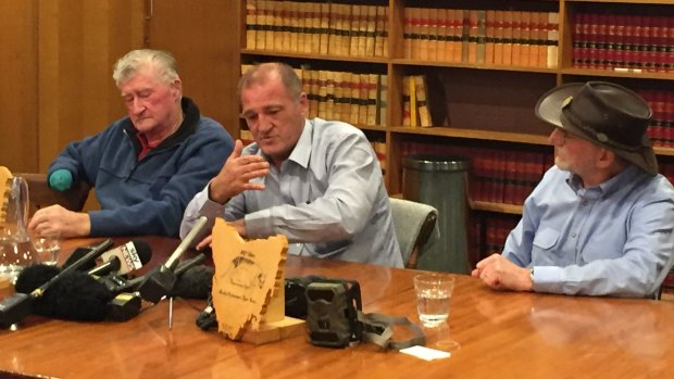 George ''Joe'' Booth, his son Greg Booth, and Adrian Richardson at a press conference in Hobart on Wednesday.