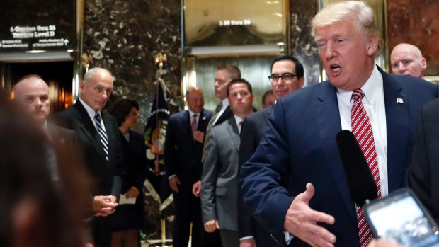 US President Donald Trump doubles down on blaming "all sides" for the Charlottesville violence in off-script remarks in the lobby of Trump Tower on Tuesday.