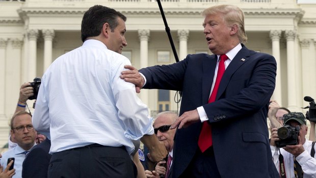 Republican presidential candidates Ted Cruz and Donald Trump greet each other during a rally in Washington in September. However, Mr Trump has since said Mr Cruz is "a bit of a maniac".