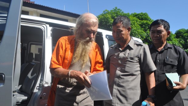 Robert Andrew Fiddes Ellis arrives at a Bali police station.