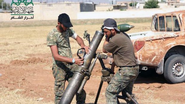 Rebel fighters from Ahrar al-Sham prepare an attack on Islamic State in Aleppo.